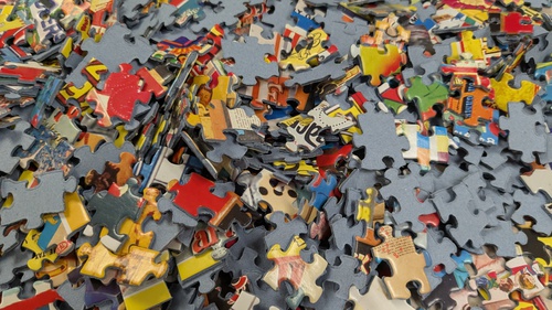 Puzzle Pieces, Puzzle pieces sitting on a table on a ferry